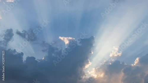 Dramatic sunburst or sun rays or god light beam through the cloud – Time Lapse