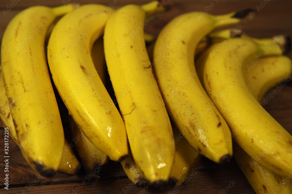 A heap of wet ripe bananas.