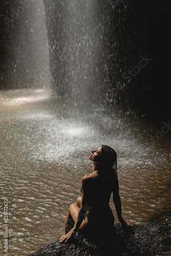 Pleased young female enjoying sounds of nature