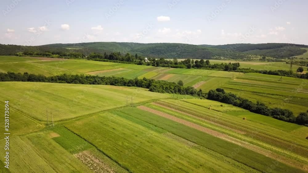 Aerial view of green agriculture fields in spring with fresh vegetation after seeding season. Aerial view of green agriculture fields in spring with fresh vegetation after seeding season.