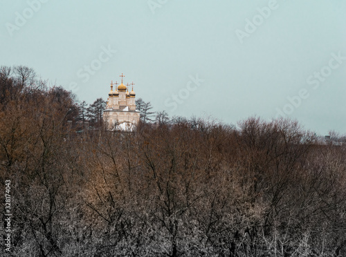 .Ryazan Kremlin. Ostrozhny hill. Church of the Transfiguration on Yar. Church  Spasa  Preobrazhenie on Yar  on the background of autumn trees.. photo