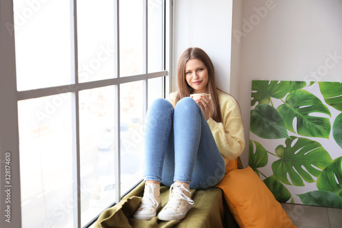 Beautiful young woman with ...