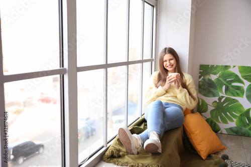 Smiling young woman relaxin...