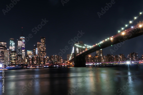 Gorgeous view of the Brooklyn Bridge and the Manhattan s skyline at night.