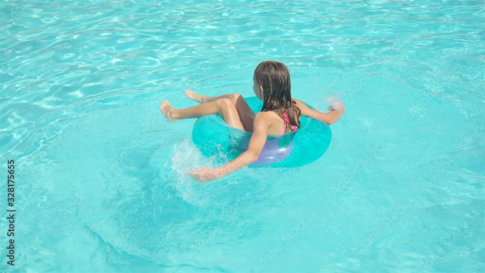 Little adorable girl in outdoor swimming pool Little adorable girl in outdoor swimming pool