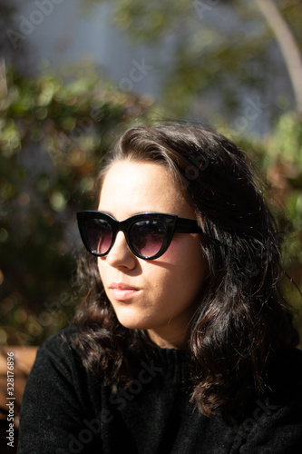 portrait of young woman in sunglasses © Silvia
