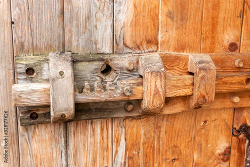 A wooden sliding lock