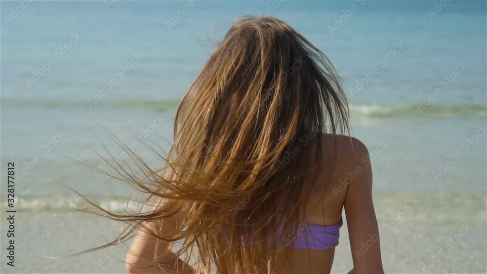 Cute little girl at beach during summer vacation Cute little girl at beach during summer vacation