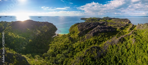 drone aerial panorama of pristine uninhabited island with bizarre tsingy rock formation/ madagascar/ nosy hara 
