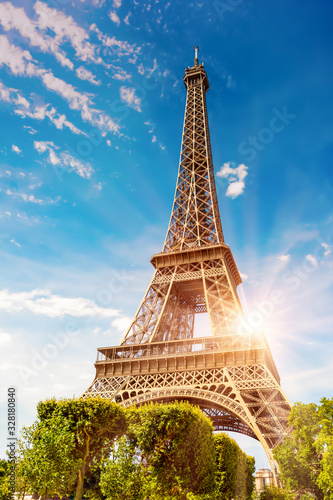 The Eiffel Tower in Paris on a beautiful sunny summer day at sunset