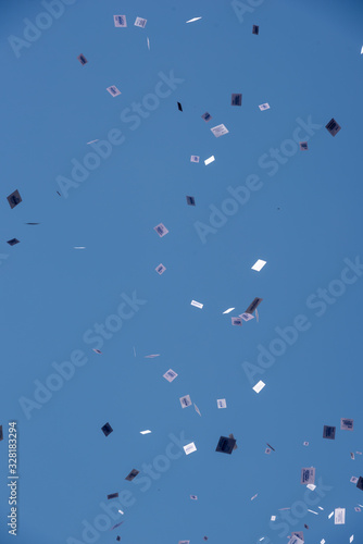 Buenos Aires, Argentina; December 10, 2019: Panflets falling from a roof of a building in the assumption of Alberto Fernandez as president