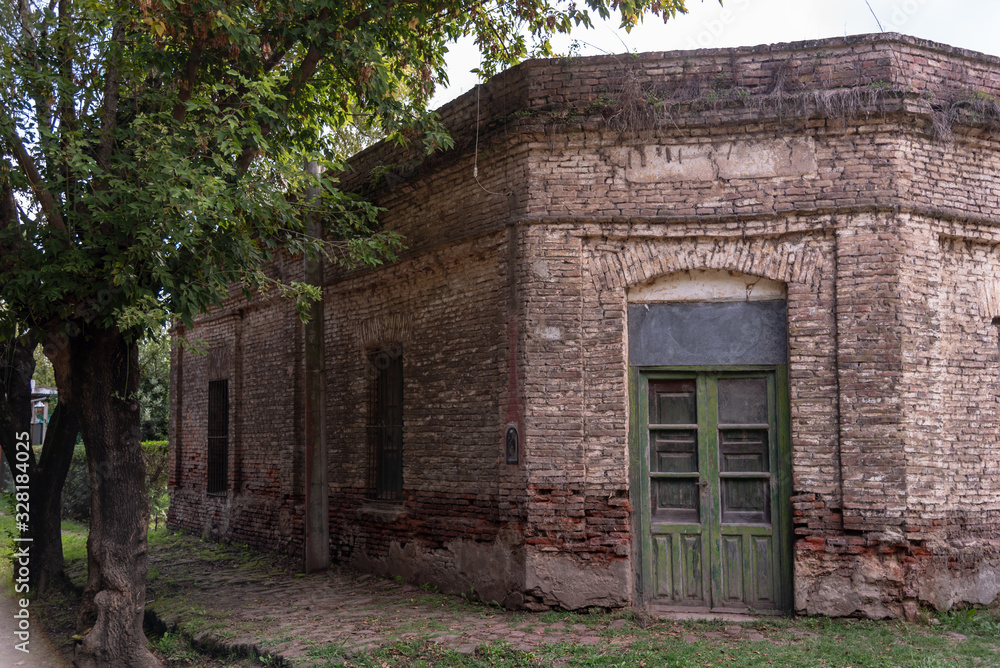 View of an old brick building with openings View of an old brick building with openings