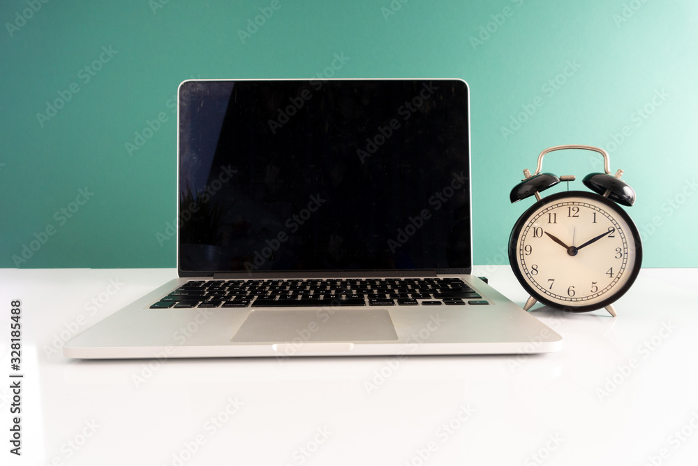 Laptop and clock with punctuality concept. Laptop and clock with punctuality concept.