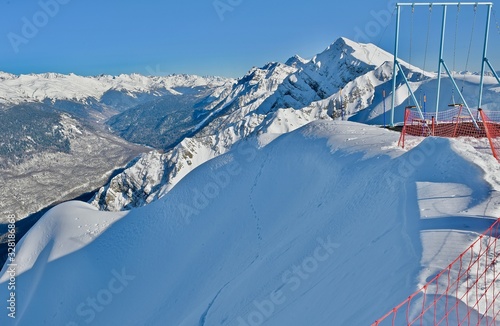 snow-capped mountain peaks in a ski resort photo