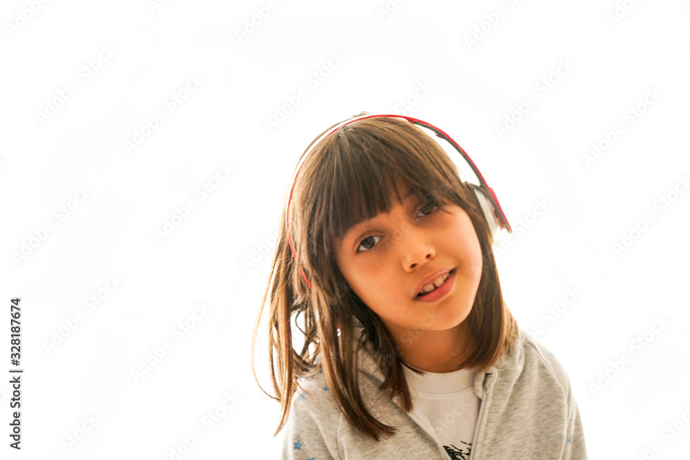 little girl with headphones at home. child girl listening to music. little girl with headphones at home. child girl listening to music.