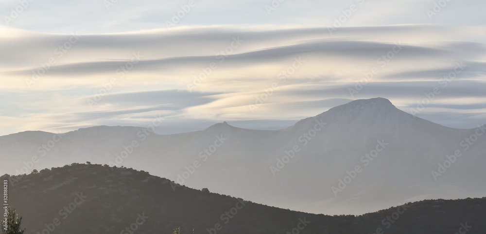 Lenticular clouds in the Andalusian countryside at sunrise