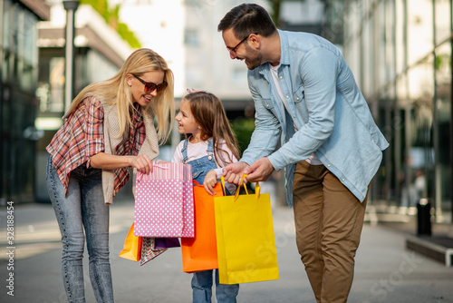 Cheerful family enjoying in shopping together