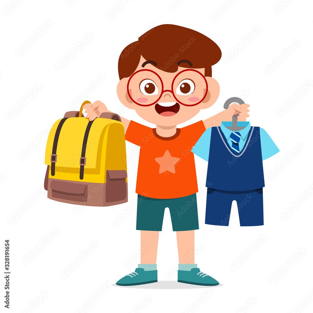 happy cute little kid boy preparing uniform for school