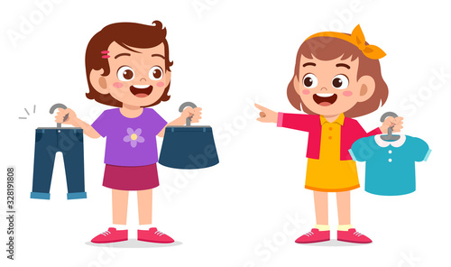 happy cute little kid girl choose clothes