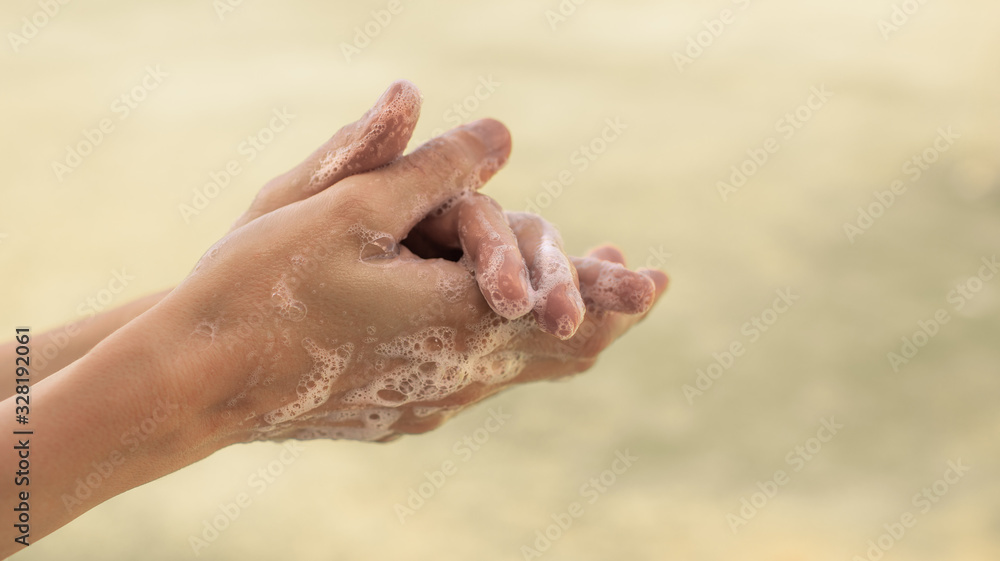 Fototapeta premium Body hygiene. Woman washing hands with soap isolated 