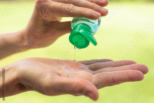 Εκτύπωση καμβά Person disinfecting hands with hand sanitizer