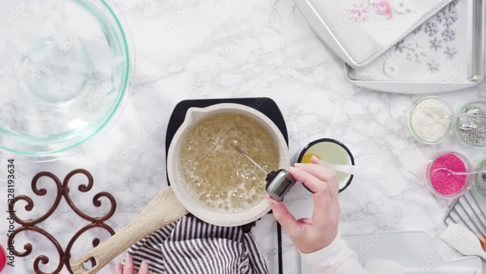 Time lapse. Flat lay. Step by step. Caramelizing sugar in a small cooking pot over the small electric stove. Time lapse. Flat lay. Step by step. Caramelizing sugar in a small cooking pot over the small electric stove.