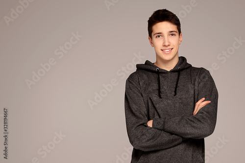 Handsome teenage boy in hoodie. photo