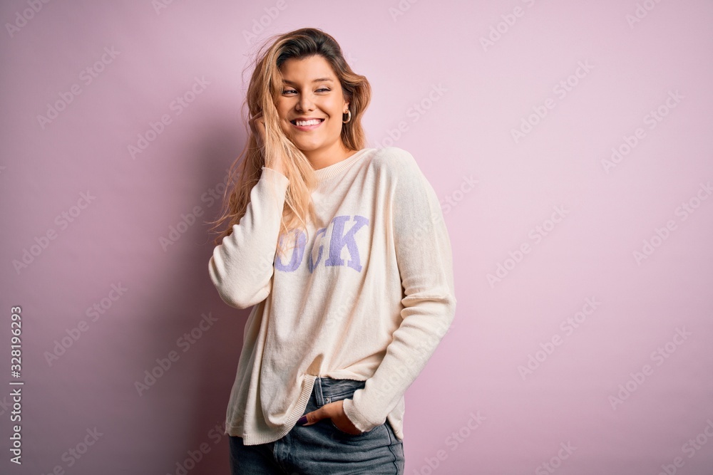 Young beautiful woman wearing fashion urban clothes, model wearing casual street style standing over pink background Young beautiful woman wearing fashion urban clothes, model wearing casual street style standing over pink background