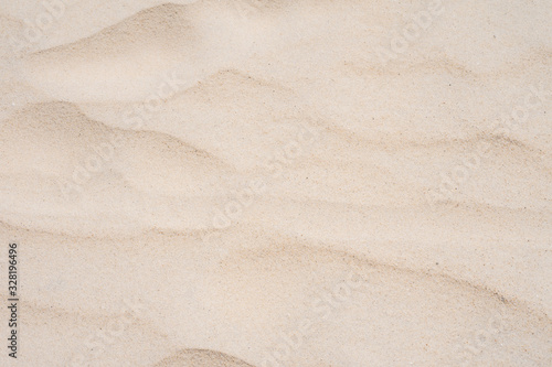 Closeup shot of sand texture on the beach as background