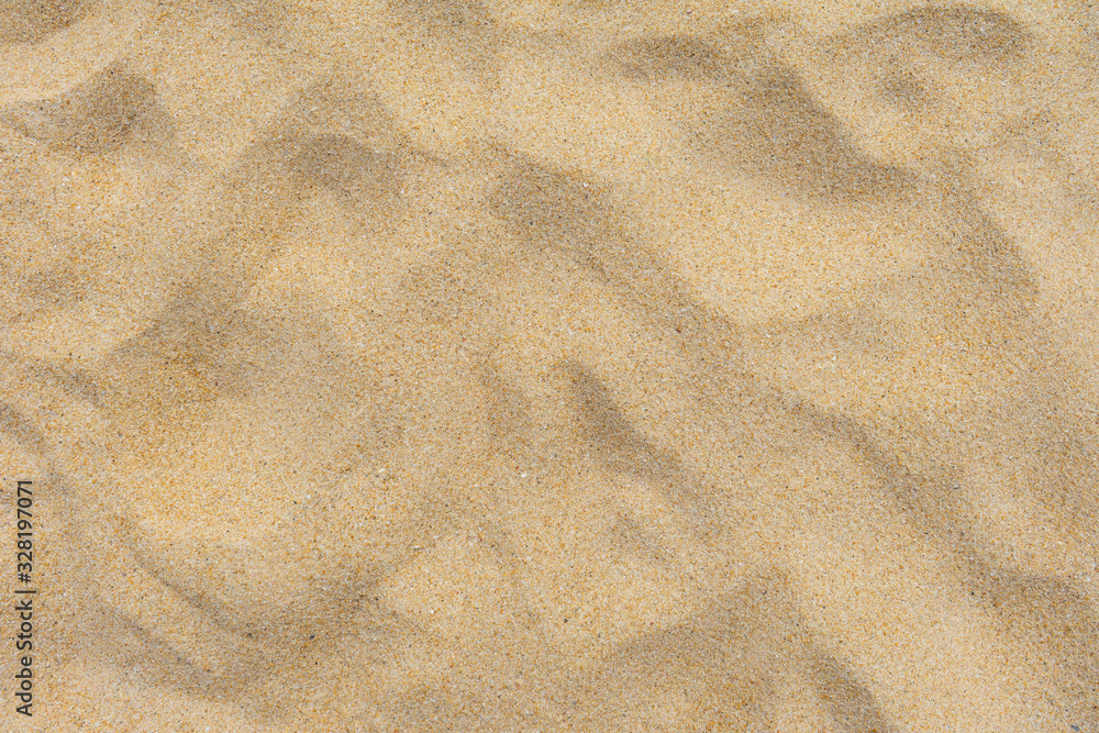 Closeup shot of sand texture on the beach as background Closeup shot of sand texture on the beach as background