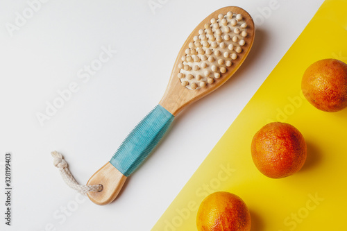 Anti-cellulite massage brush on a white background. Orange peel cellulite concept. Lymphatic drainage massage. Place for text. organic cactus brush © Ekaterina