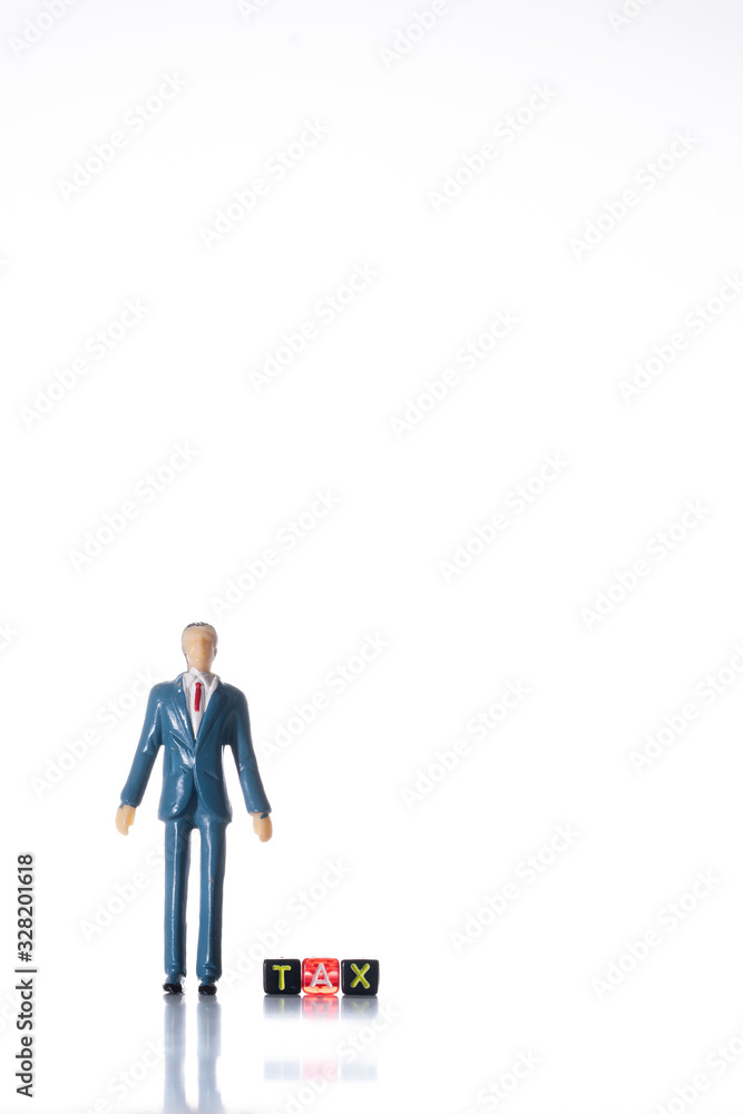 Miniature people with block TAX