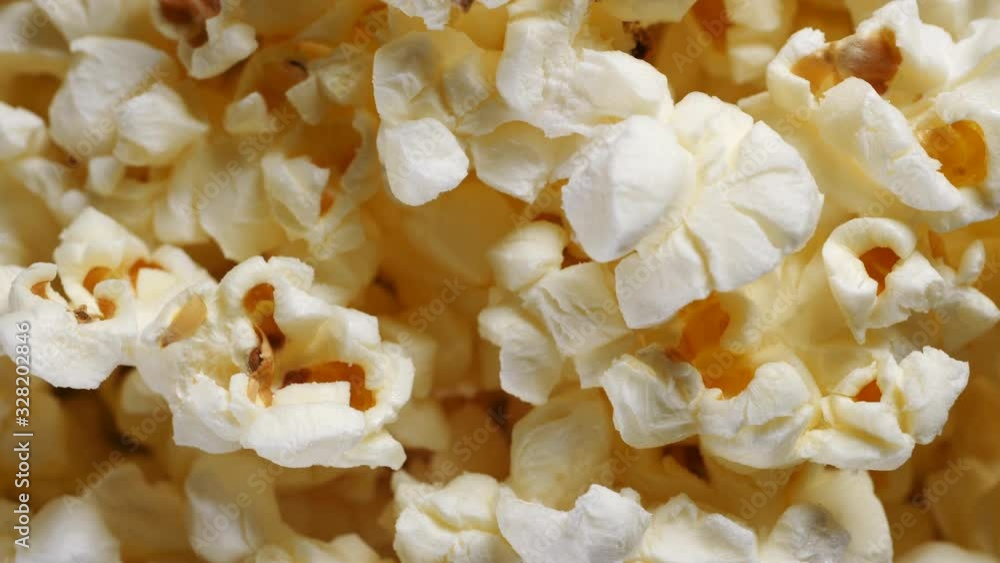 Rotating popcorn with salt shot in extreme close up macro Rotating popcorn with salt shot in extreme close up macro