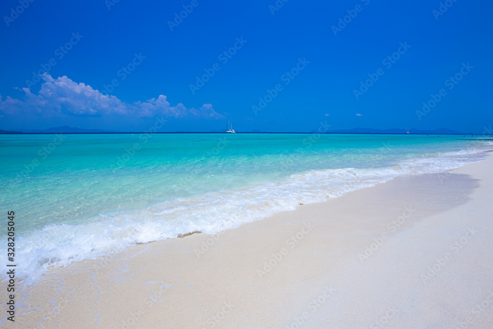 Beautiful summer beach with clear water and blue sky in south of thailand