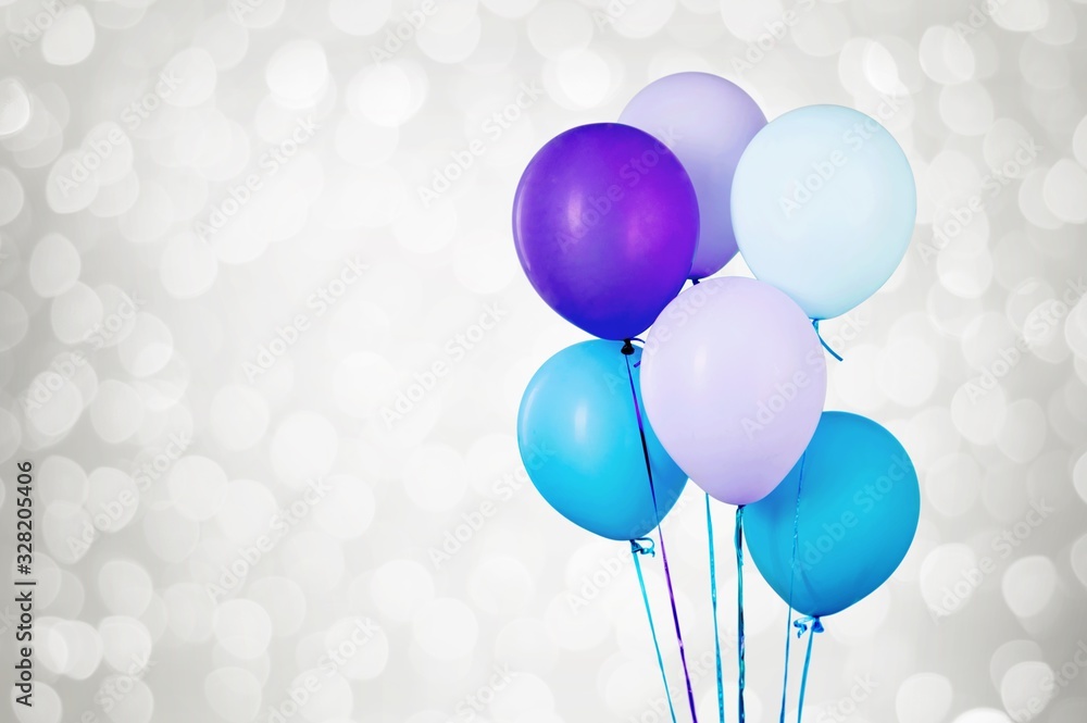 Bunch of colorful balloons on white bokeh background
