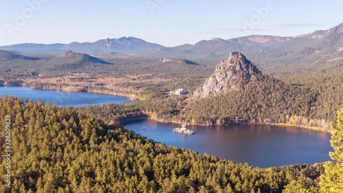 Majestic view of Blue Bay and Okzhetpes rock in autumn season in Burabay, Kazakhstan; time lapse zoom in photo