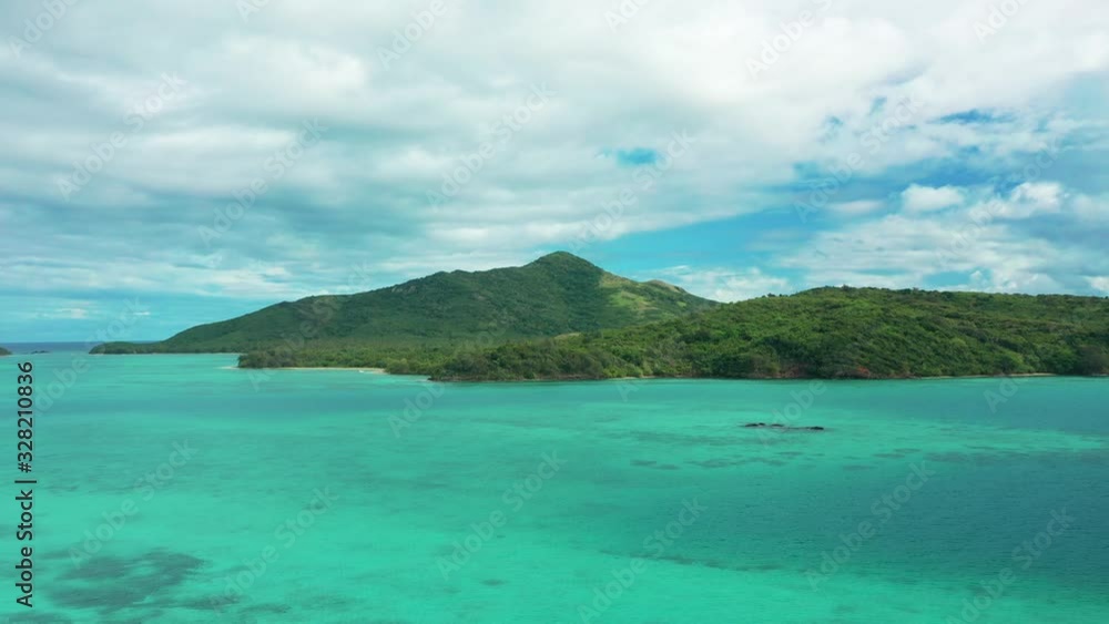 The beautiful, pristine turquoise waves of the Fiji mountain islands - aerial The beautiful, pristine turquoise waves of the Fiji mountain islands - aerial