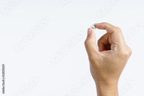 Hand holding aluminium snap fastener clip button