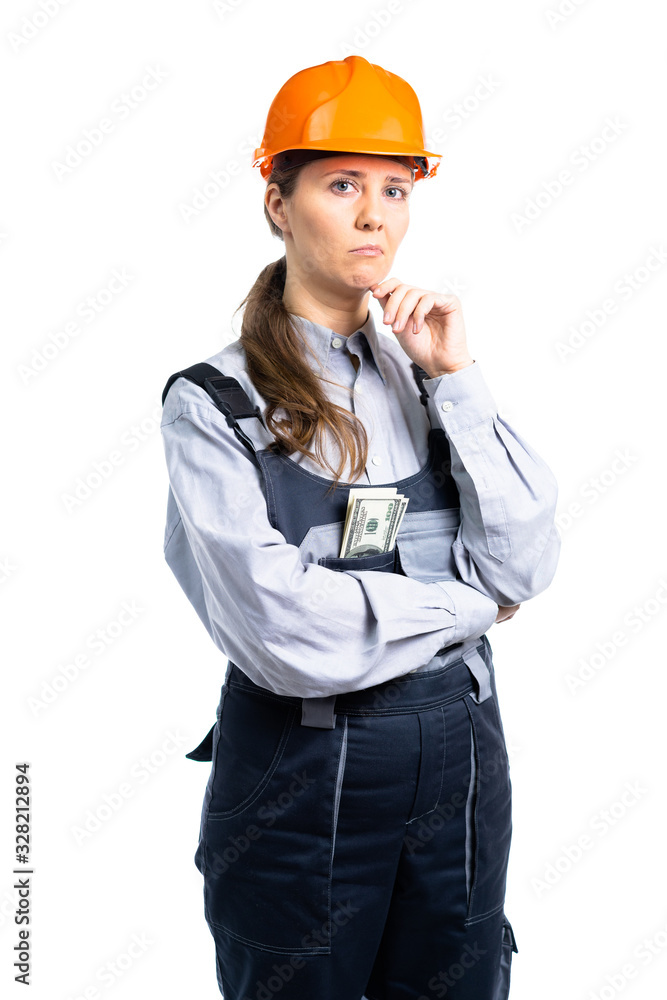 Female construction engineer with dollars in her pocket with a serious look. isolated Female construction engineer with dollars in her pocket with a serious look. isolated