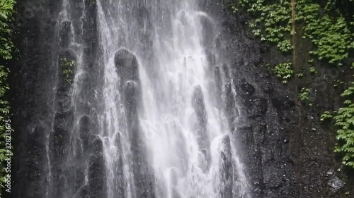 Wallpaper Mural the water flowed profusely on a waterfall in a dense forest Torontodigital.ca