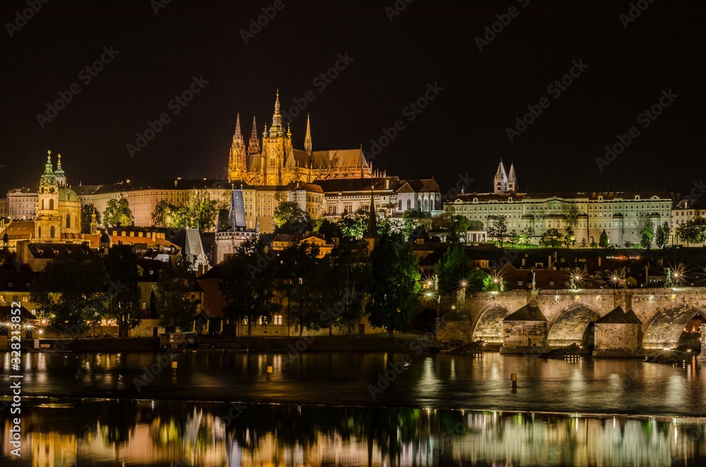 Charles Bridge and St Vitus Cathedral at night in Prague Czech Republic