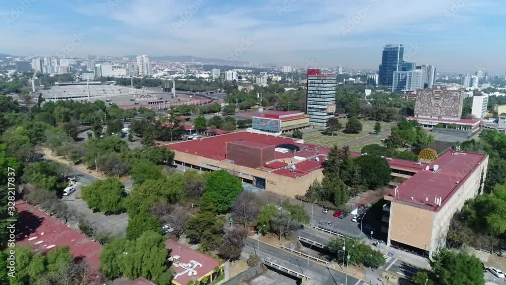 sunny day, slow drone movement over university UNAM campus in Mexico City sunny day, slow drone movement over university UNAM campus in Mexico City