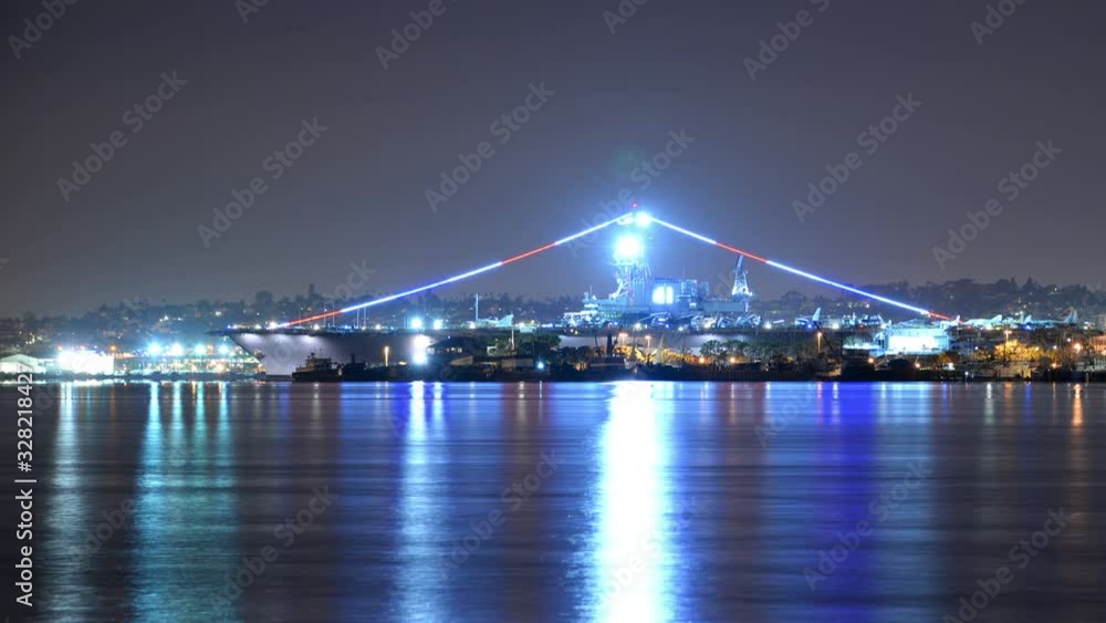 San Diego Night Time Lapse of Battleship USS Midway from Coronado California USA Pan Right San Diego Night Time Lapse of Battleship USS Midway from Coronado California USA Pan Right