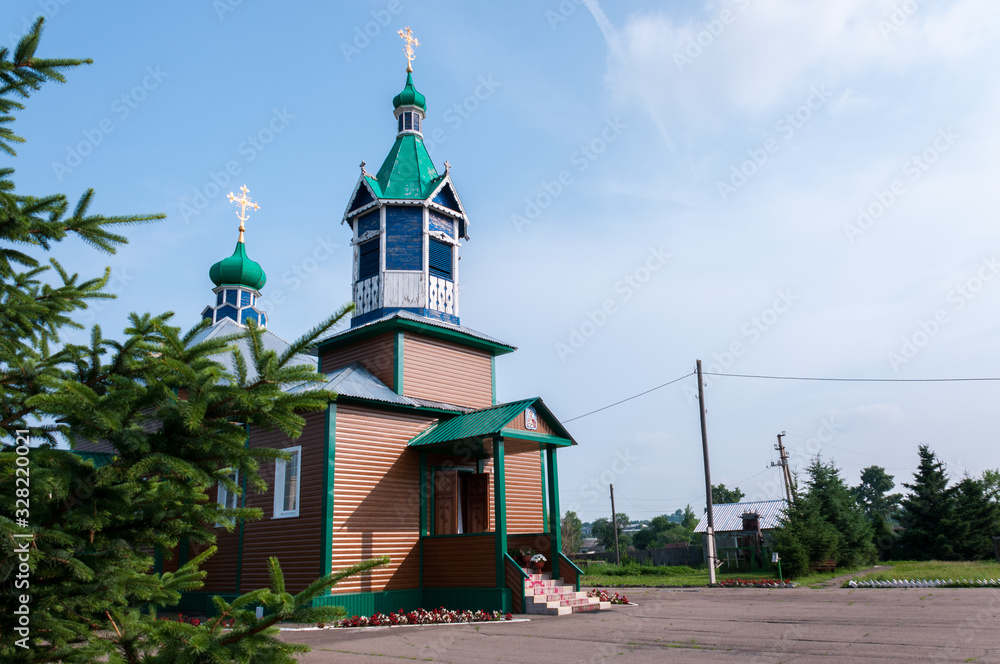 Russia, Blagoveshchensk, July 2019: Summer. Wooden rural Church in the village of Ignatievo near the city of Blagoveshchensk Russia, Blagoveshchensk, July 2019: Summer. Wooden rural Church in the village of Ignatievo near the city of Blagoveshchensk