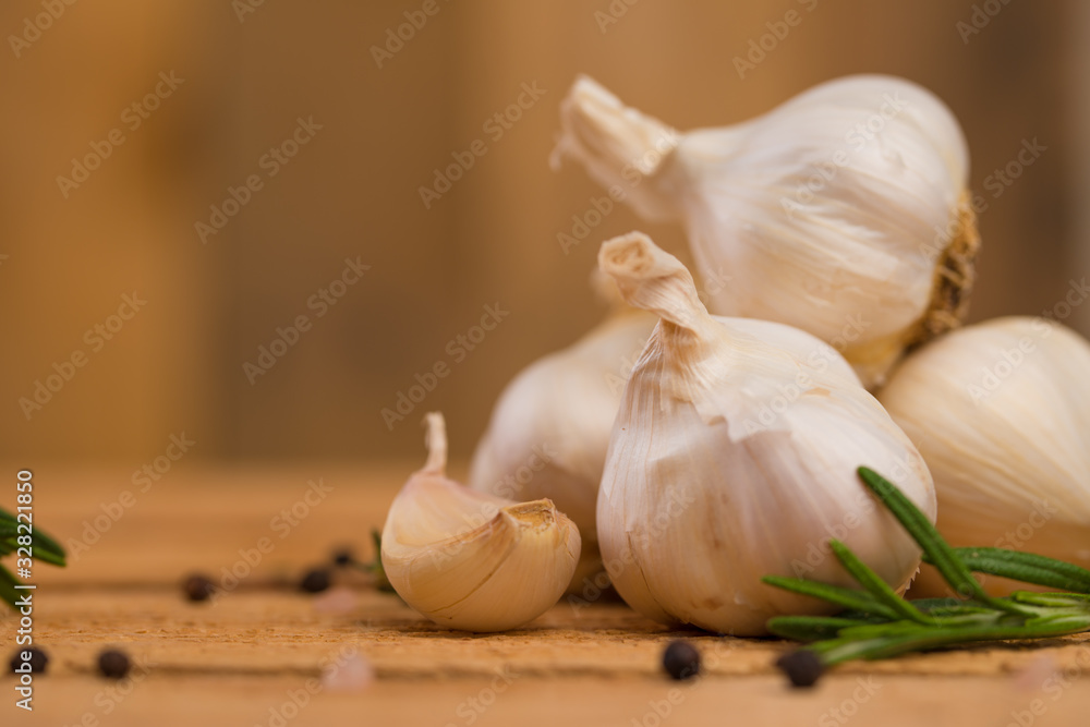 Garlic and spices on a wooden background, cooking saver Garlic and spices on a wooden background, cooking saver