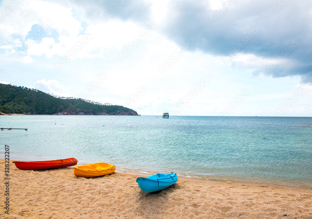 Canoes on the Mae Haad Beach, Koh Phangan, Thailand Canoes on the Mae Haad Beach, Koh Phangan, Thailand