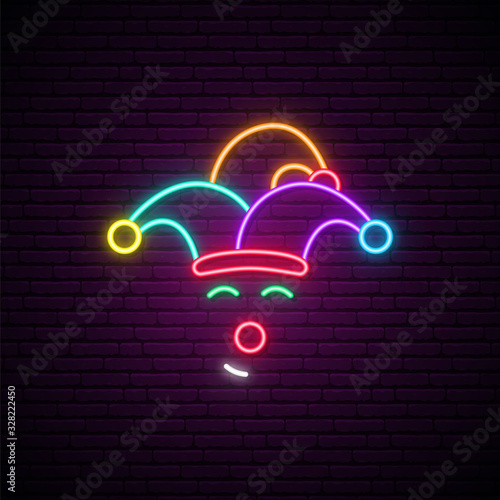 Neon clown sign. Shiny circus emblem on dark brick wall background. Clown vector illustration.
