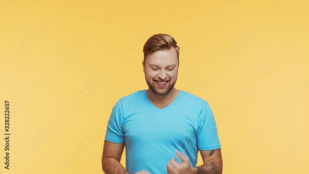 Expressive young man over vibrant background. Studio portrait of handsome person. Expressive young man over vibrant background. Studio portrait of handsome person.