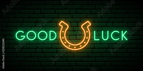 Horseshoe neon sign. Shiny horseshoe and text Good luck. Neon signboard. Vector St. Patrick’s day banner.