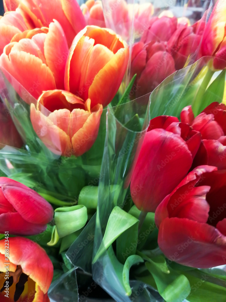 Bright bouquet of red and yellow tulips with green leaves. Bright bouquet of red and yellow tulips with green leaves.